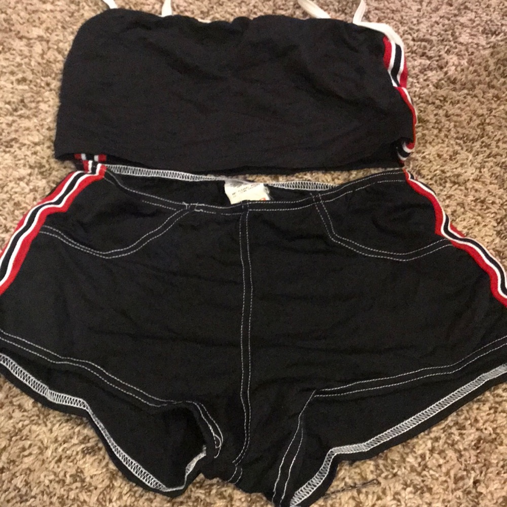 Black tankini with red and white stripes.